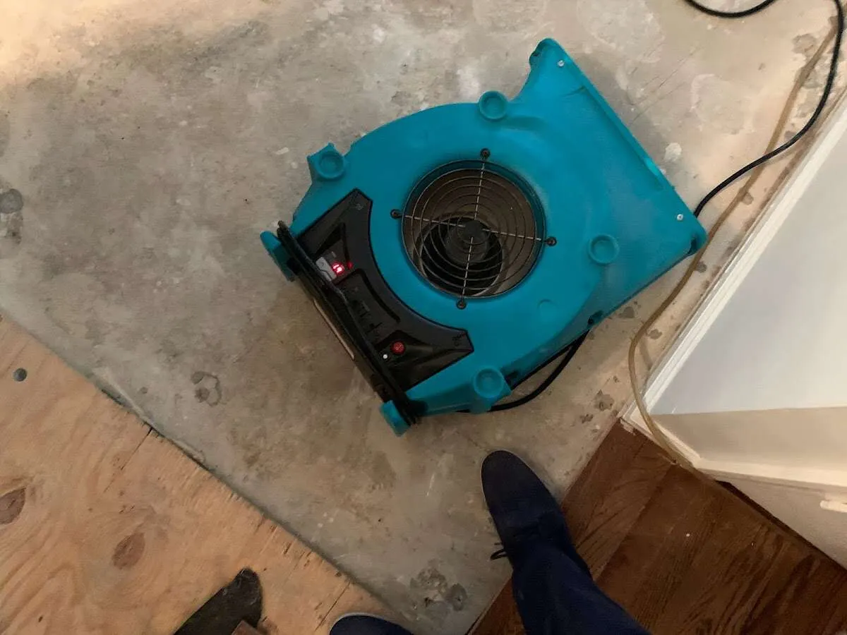 Air mover drying subfloor during Leak Detection & Repair in Morton Grove